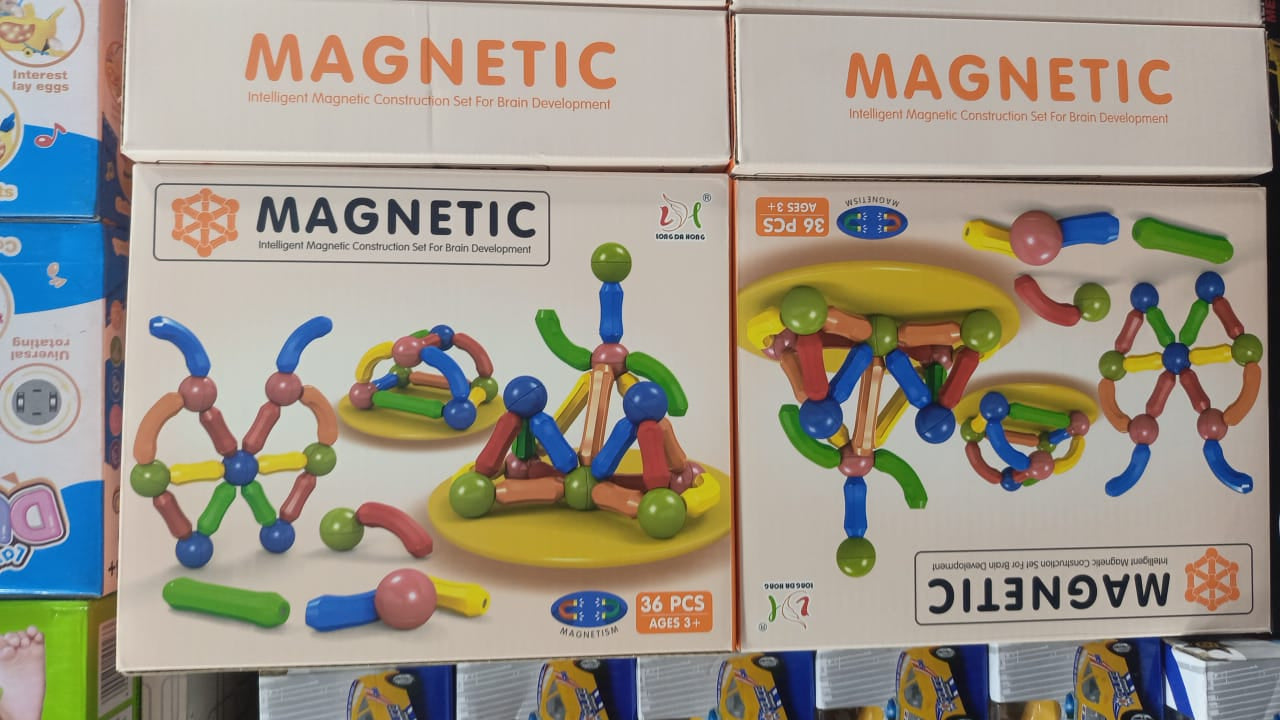 Magnetic sticks building toy set in retail packaging, colorful rods with balls